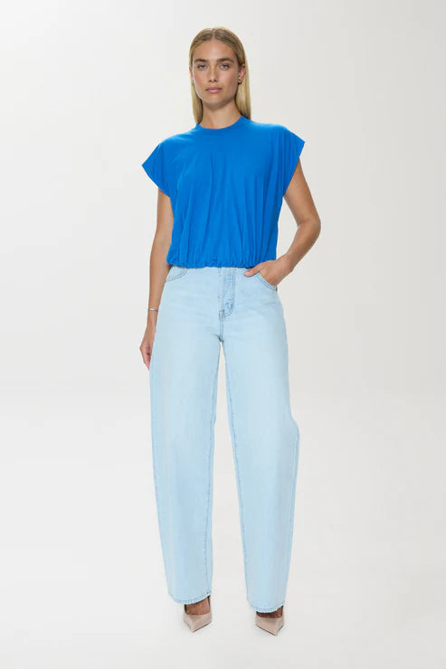 Model wearing blue textured cotton T-shirt with light jeans