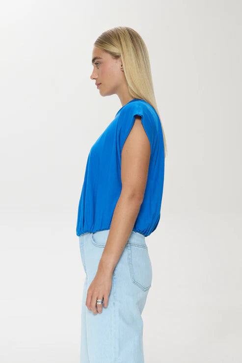 Side profile of blue textured cotton bubble tee