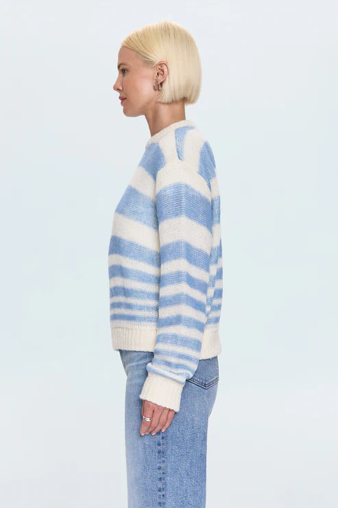 Side view of blue and white striped knit sweater