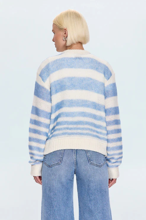 Back view of blue and white striped knit sweater