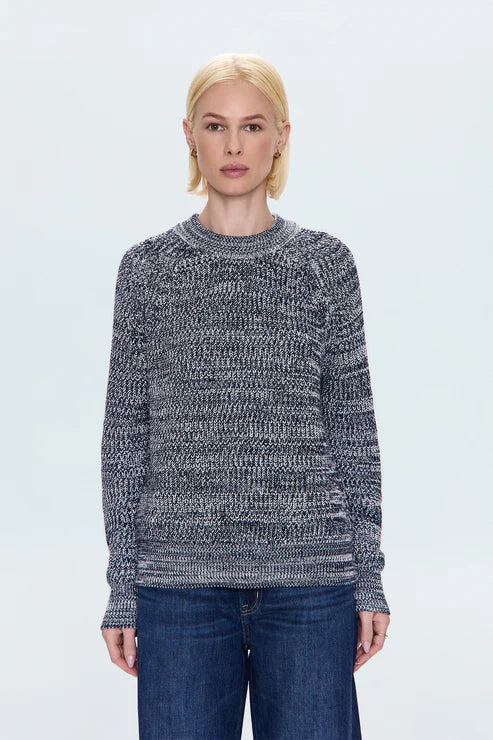 Front view of women in navy marl knit sweater, versatile casual look