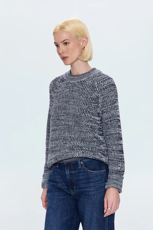 Side profile of woman in navy marl knit sweater, stylish casual outfit