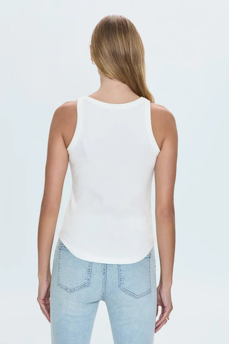 Close-up of white ribbed tank top fabric and label